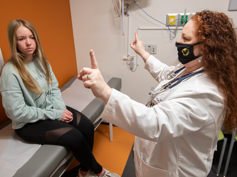 Children's of Mississippi patient Sophia Heffelfinger of Madison follows Dr. Michelle Goreth's fingers with her gaze as part of a post-concussion test.