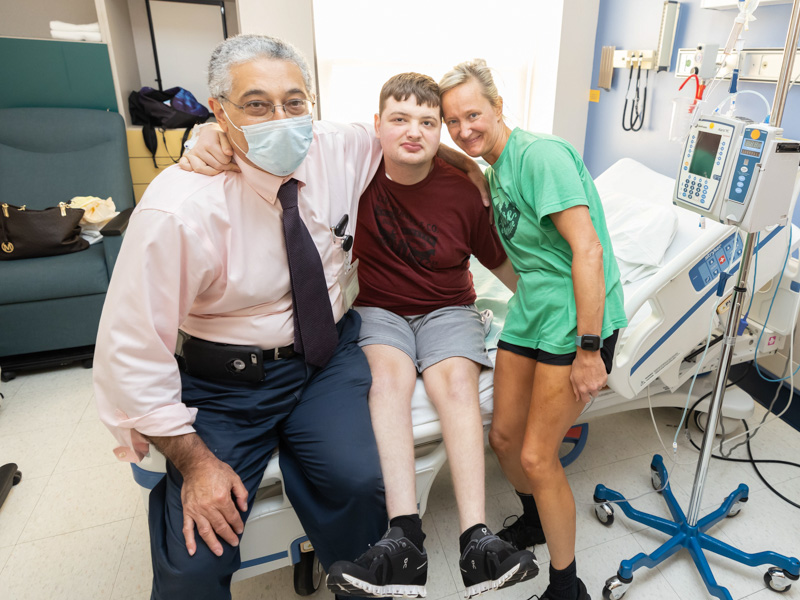 Dr. Makram Ebeid, director of pediatric interventional cardiology and the pediatric catheterization lab at UMMC, smiles with patient Cameron Kittrell and Cameron's mom Shannah of Pearl.