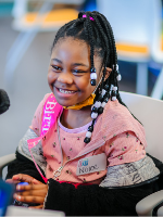 Girl smiling at Mississippi Miracles Radiothon