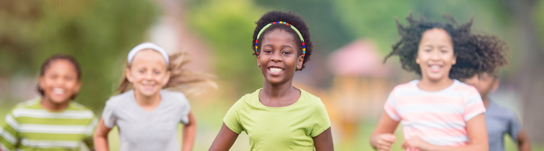 smiling child playing outdoors