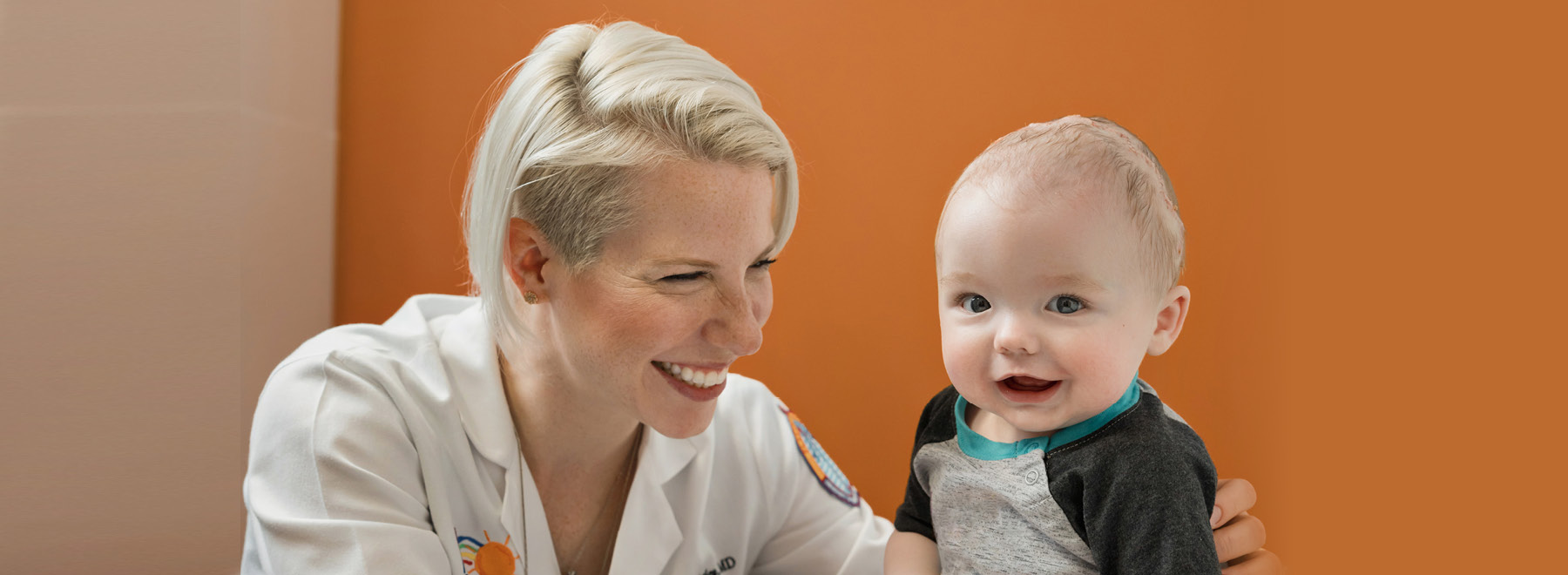 UMMC Provider smiling at child.