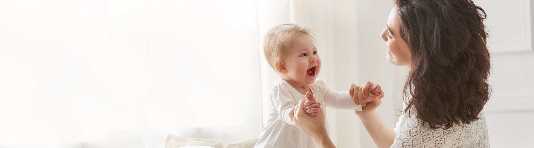 toddler and woman playing