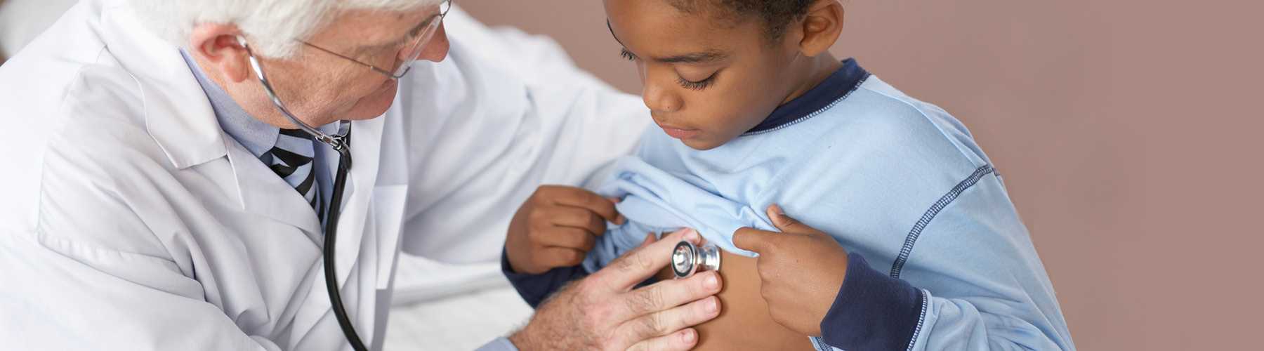 doctor listening to child's heart