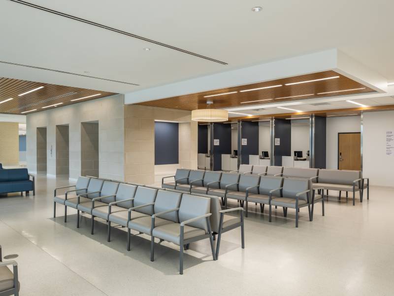 Seating area with desks and elevator bank.