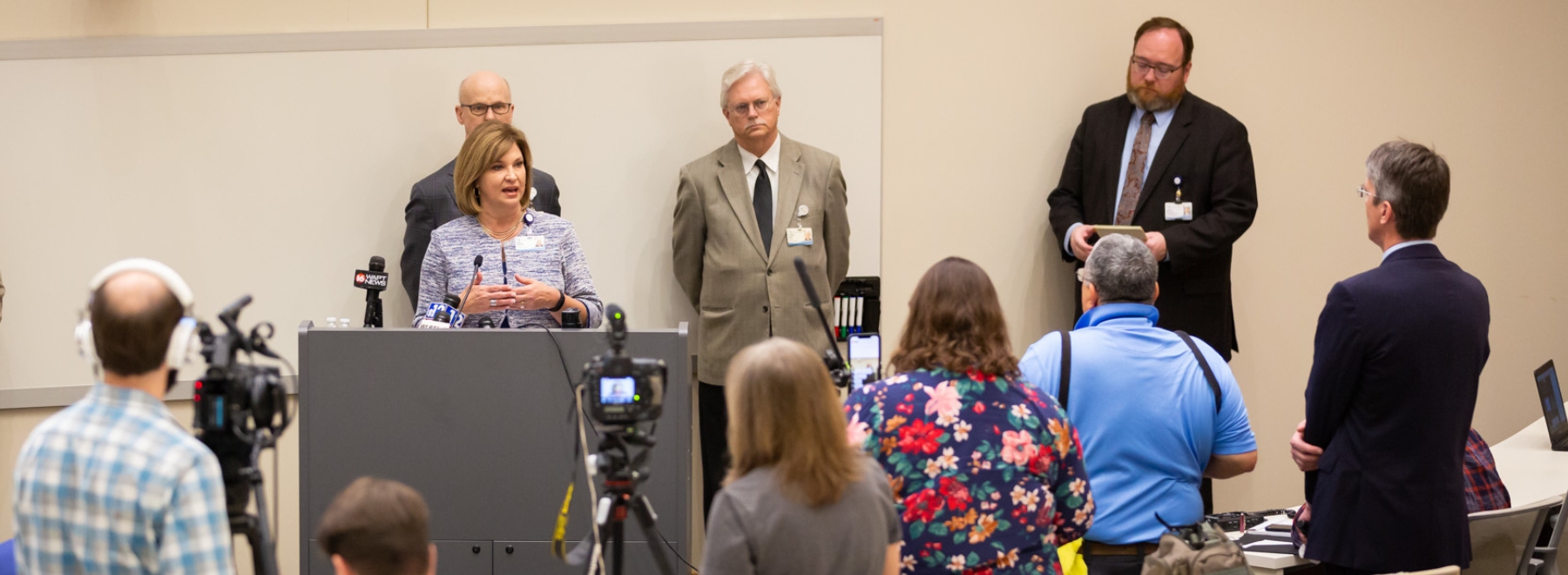 Dr. LouAnn Woodward addresses a pool of reporters and accompanying videographers as Dr. Charles O'Mara, Dr. Richard Summers and Dr. Jonathan Wilson look on. Dr. LouAnn Woodward addresses a pool of reporters and accompanying videographers as Dr. Charles O'Mara, Dr. Richard Summers and Dr. Jonathan Wilson look on.