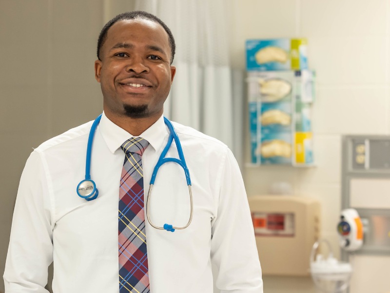Male nursing student smiling.