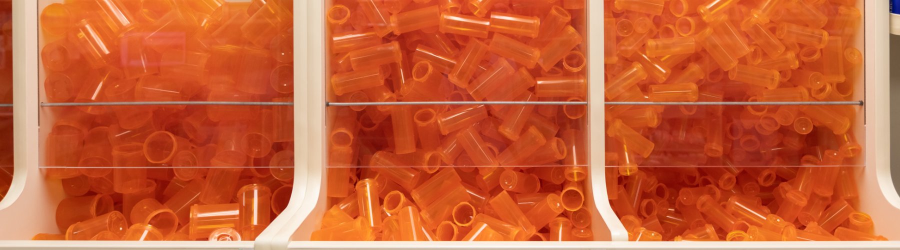 Empty orange medication tubes.