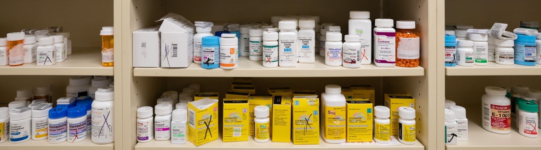 A closeup of shelving with many different medicines on display.