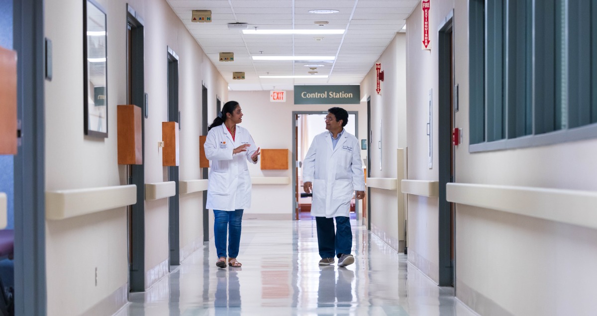 Providers walk through in-patient sleep study hallway.