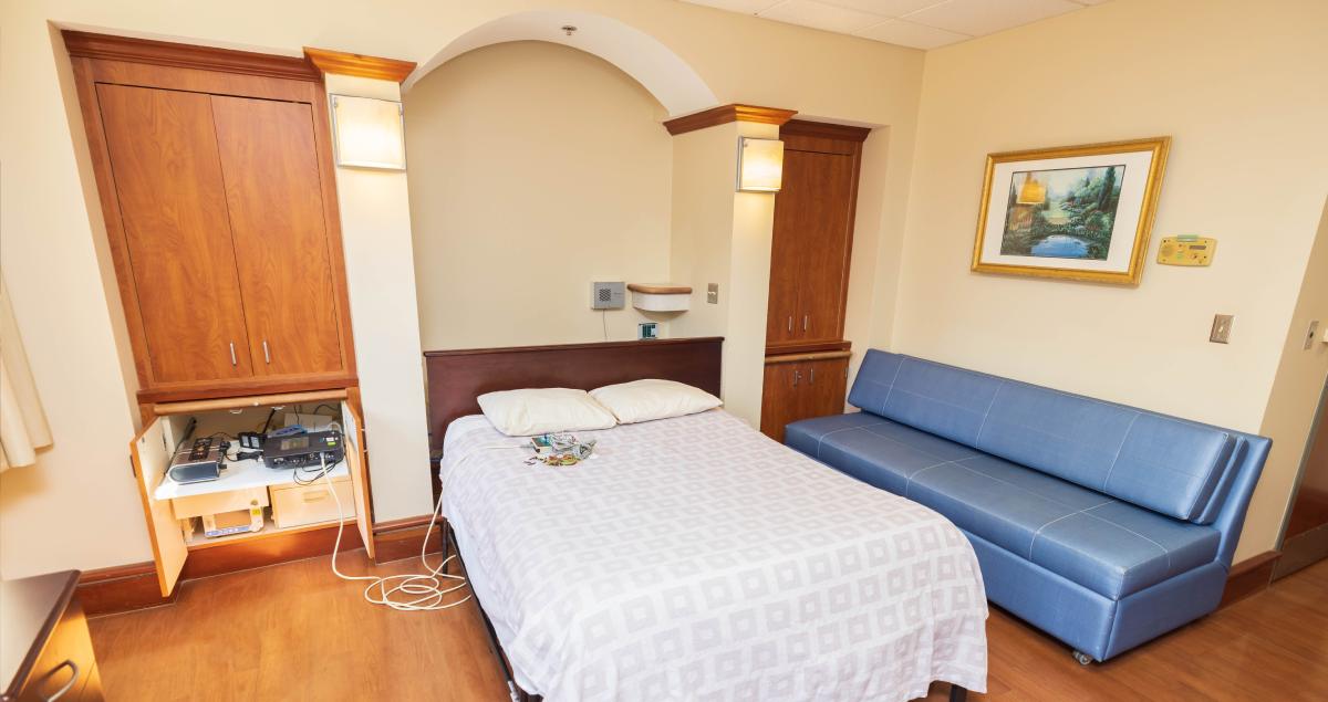 Hospital room with a bed and minimal equipment. This is where in-patient sleep studies take place.