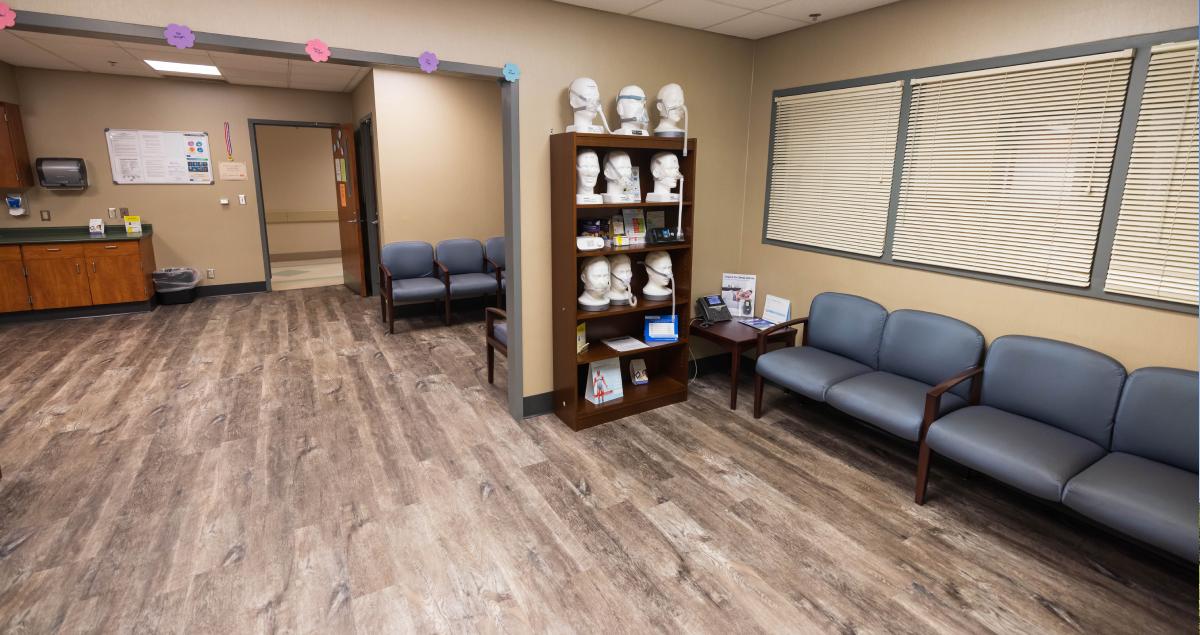 Sleep study waiting room area includes several chairs and a check-in window.