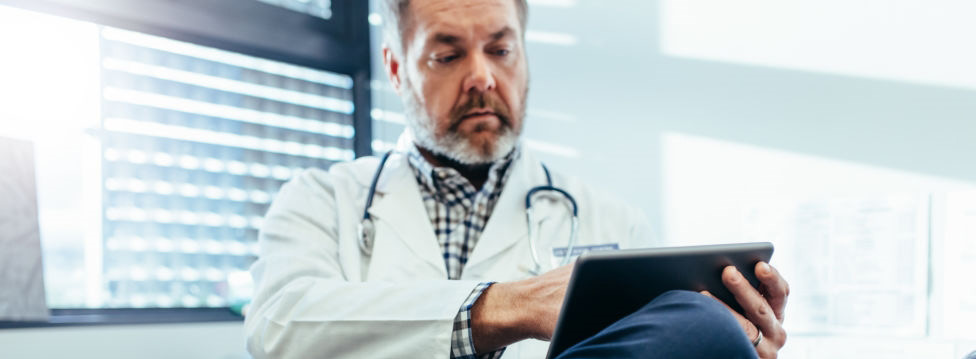 Physician reviewing chart