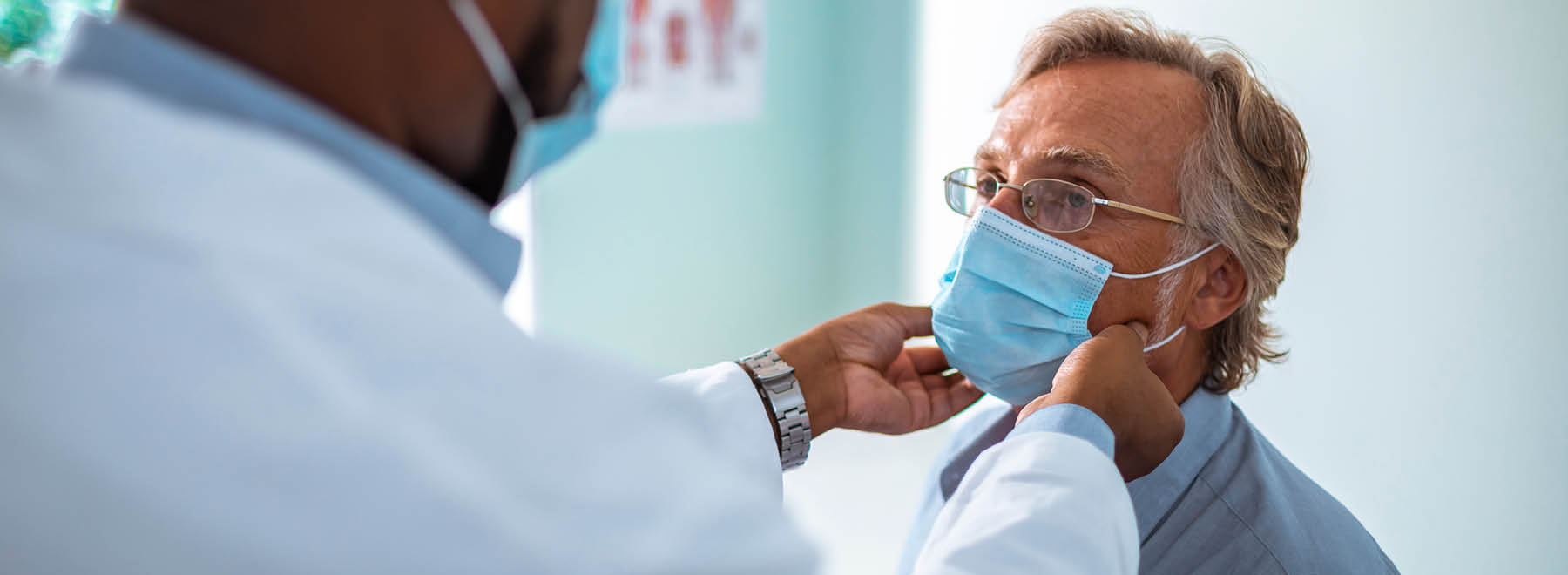 Man in mask at doctors appointment