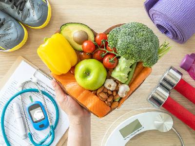 A collage image featuring healthy vegetables in the shape of a heart 