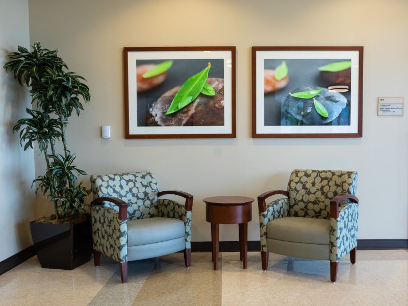 Two chairs with paintings in between, interior of UMMC Madison.