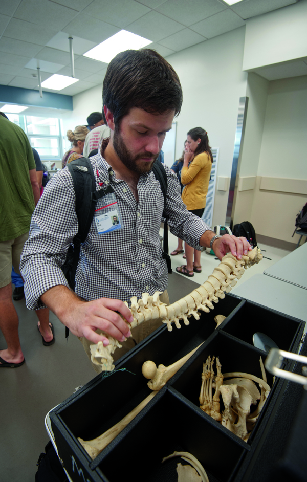 Ian Taylor scrutinizes a bone kit.