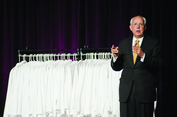 Dr. Darrell Kirch, president and CEO of the Association of American Medical Colleges, speaks to the School of Medicine’s Class of 2014 during the May 22 Long Coat Ceremony.