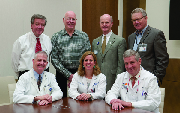 Members of CRITTers, the acronym for a committee formed to improve relations between university physicians and the  community’s private-practice doctors, reunited on March 25 to discuss their progress and the restructuring of the Office  of Physician Relations. They are, back row, from left, Dr. Bryan Barksdale, Dr. James Keeton, Dr. Charles O’Mara and Dr.  Jim Sones; front row, from left, are Dr. Dan Woodliff, Dr. Mildred Ridgway and Dr. John Purvis.