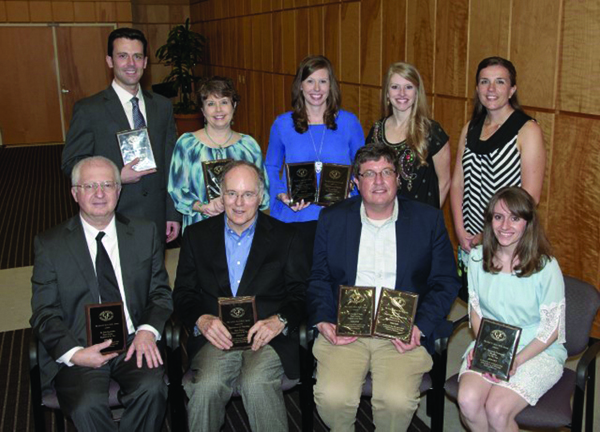 Evers Awards  recipients include, seated from left, Dr. Bela Kanyicska, M1 Professor of the Year; Dr. Davis Manning, representing the M1 Department of the Year: the Department of Physiology; Dr. Stephen Stray, M2 Professor of the Year and representing the M2 Department of the Year: Microbiology; and Dr. Savannah Duckworth, third-year Resident of the Year; and standing from left, Dr. Corey Jackson, M3 Attending of the Year; Jan Simpson, M3 Course Administrator of the Year; Dr. Michelle Horn, representing the M3 and M4 Department of the Year: the Department of Medicine; Dr. Lyssa Weatherly, Fourth-year Resident of the Year; and Dr. Lisa Didion, M4 Attending of the Year.