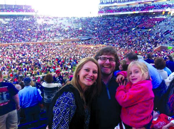 Dr. Jason Murphy, center, with wife Susan and daughter Lydia at the 2014 Ole Miss-Alabama football game