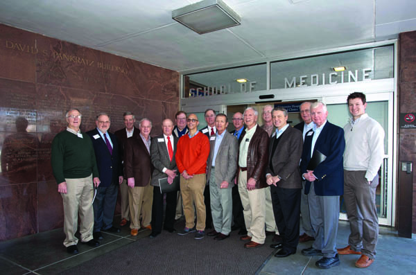 During a tour of the campus, reunion attendees stopped by the School of Medicine. They are, from left, Dr. Buddy Meyer; Dr. Pat Barrett; Dr. John Purvis; Dr. Mitch Massey; Dr. Bill Edwards; Dr. David Gandy; Dr. George Russell, chair of the Department Orthopaedic Surgery and Rehabilitation; Dr. John Drake; Dr. Robert Marascalco; Dr. Bill Marshall; Dr. Tom Jeffcoat; Dr. Bill Stewart; Dr. Doug Rouse; Dr. Gene Barrett; Dr. Hugh Brown; and current orthopaedic surgery resident Dr. Jimbo Moss.
