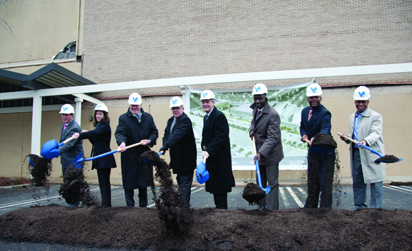 State and city leaders and UMMC representatives join Scott Thompson, fourth from left, founder and CEO of Venyu Solutions, during a February groundbreaking for the Venyu Technology Center, which will include a newly constructed building to be leased by the UMMC Center for Telehealth.