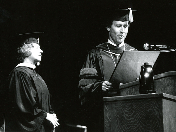 Graham listens to a reading of her retirement citation by then-Chancellor Dr. R. Gerald Turner during commencement. Graham retired officially on June 30, 1986 after 31 years of service at the Medical Center.