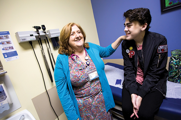 Megason shares a laugh with patient Sydney Holifield of Laurel.