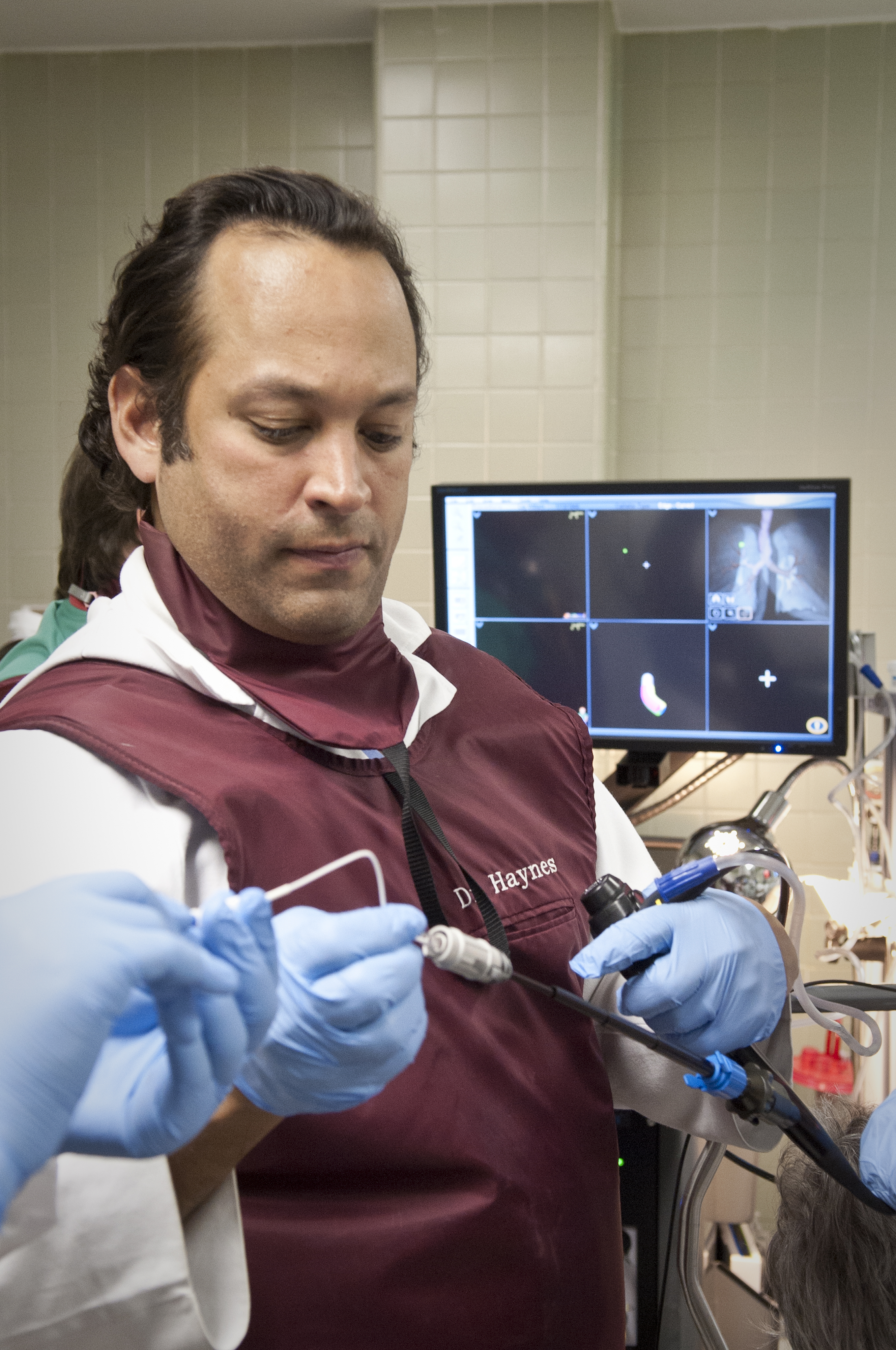 Dr. Pierre de Delva, UMMC thoracic surgeon, prepares for an electromagnetic navigation bronchoscopy case.