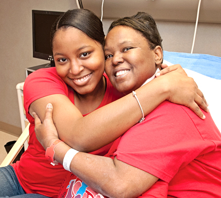 Sharon, right, gets a big hug from her daughter Ronneccia Mackey.