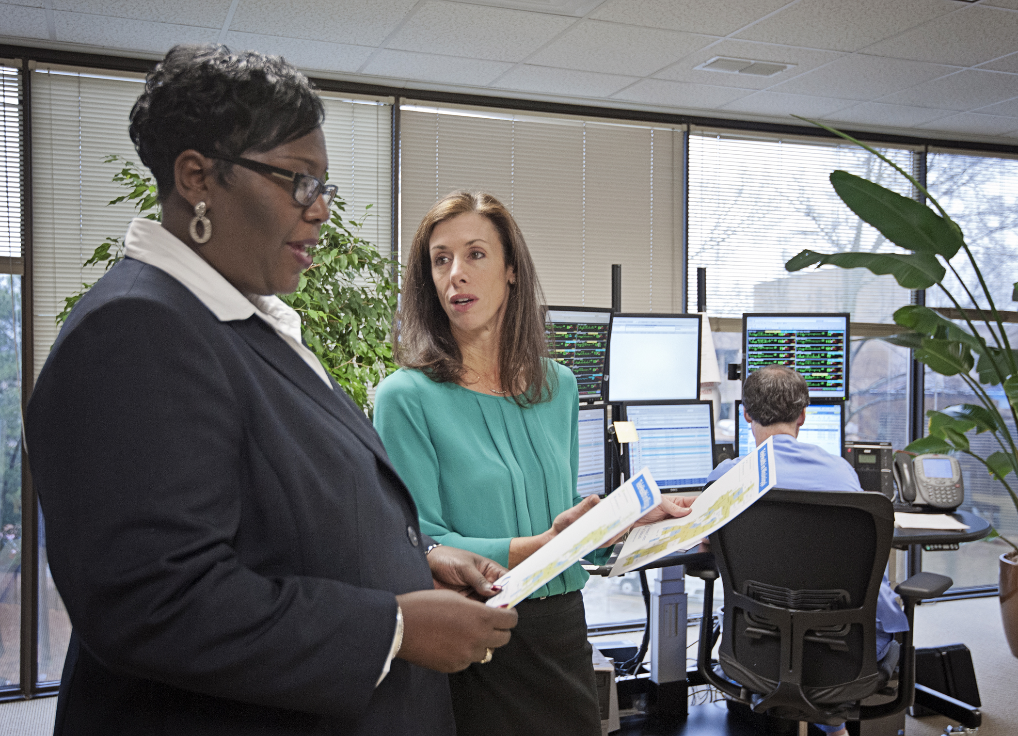 Trina George, left, Mississippi state USDA director of rural development, and Dr. Kristi Henderson, UMMC director of Telehealth and chief advanced practice officer, discuss how the new projects will improve access to care in the state.