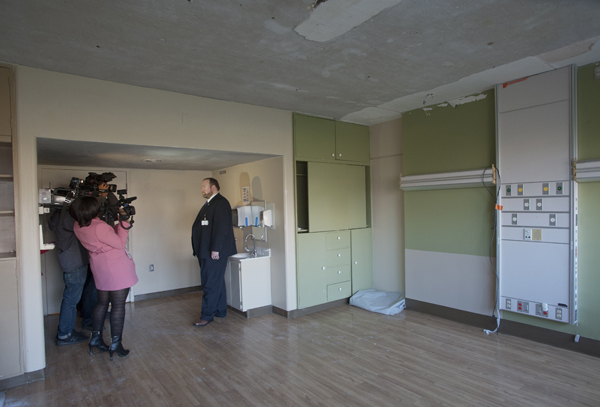 Jonathan Wilson stands in a patient room at the Medical Center's University Rehabilitation Center as he explains to media how the facility is being retrofitted as a separate isolation unit for initial care of probable or confirmed Ebola patients should the need arise.