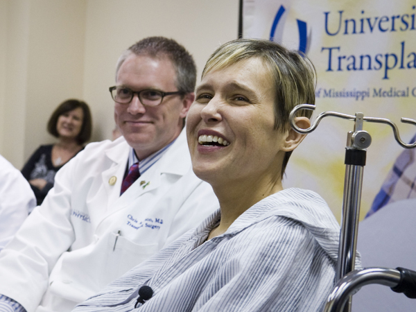Battle is jubilant during a press conference after her liver transplant in March 2013. Pictured with her is Dr. Chris Anderson.