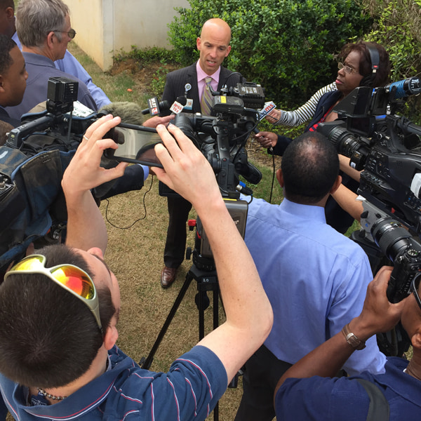 Jones, center, briefs local media