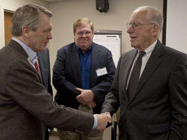 Dr. Doug Rouse, left, greets former Gov. William Winter, who served as attorney for the "Recalcitrant Residents" in 1976. Looking on, center, is Dr. David Gandy.