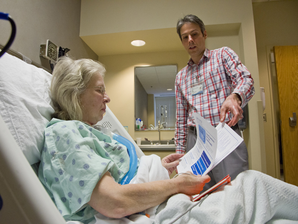 Delia Shirley of Jackson listens as patient affairs advocate Allan Boteler explains brochures and flyers that contain tips on how patients can have a safe stay and be engaged in their own care.