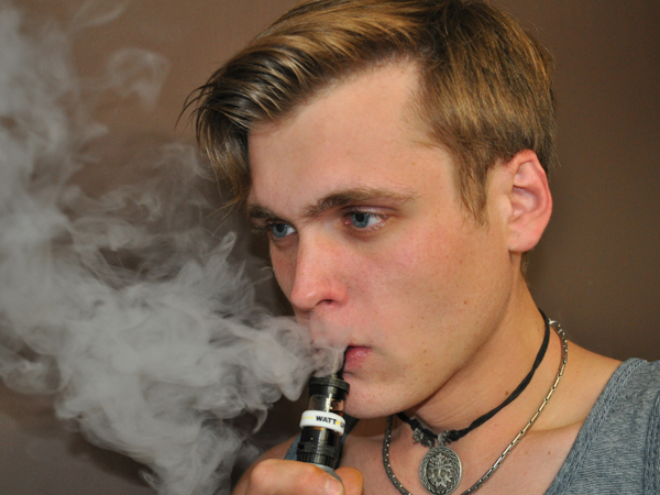 Jeramie Britt, 21, of Brandon, uses an e-cig.