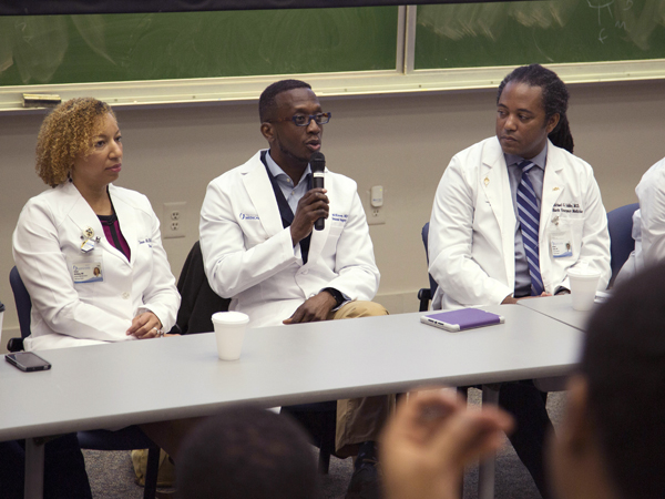 Among the panelists are, from left, Dr. Shawn McKinney, associate professor of surgery, Dr. Gerald McKinney (with microphone), associate professor of surgery, and Dr. Michael Holder, associate professor of pediatrics and executive director of simulation and interprofessional education.