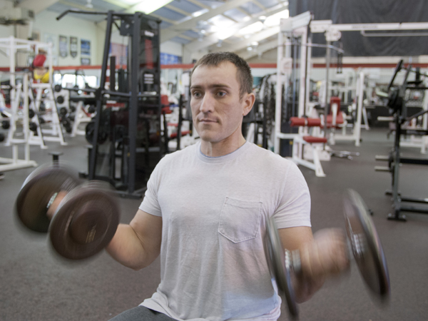 Sean Alexander lifts weights at The Courthouse Racquet and Fitness exercise center in Flowood.