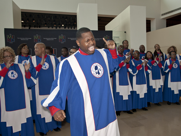 Jermichael Riley leads the Mississippi Mass Choir at a party for sponsors of the Gladys Knight benefit concert for the MIND Center. The choir sang several songs at the pre-concert event hosted at the Mississippi Museum of Art shortly before the concert on Sunday night.