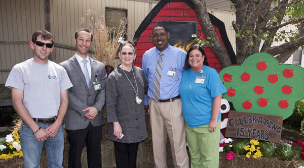 Joining in the celebration of UMMC Holmes County's 15th year are (from left) Ryan Cain, UMMC Holmes County maintenance mechanic; Arthur Jones, UMMC Holmes County construction project manager; Pamela Hooker, UMMC Holmes County administrative assistant; Dewery Montgomery, director of ambulatory operations at UMMC Holmes County and UMMC Grenada; and Elizabeth Adcock, UMMC Holmes County manager of performance improvement.