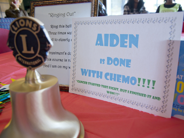 Aiden Johnson's certificates and mementos from the Children's Cancer Clinic at Batson Children's Hospital are on display, as is the bell for the clinic's ringing-out ceremonies.