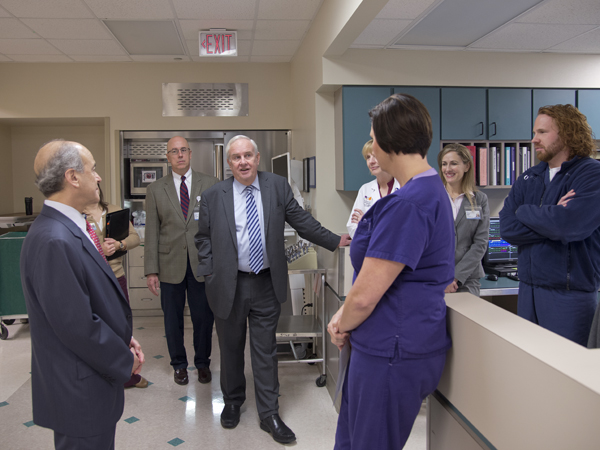 (From left) Dr. Mark Chassin, CEO and president of The Joint Commission; Dr. Thomas Prewitt; and Dr. Michael Henderson chat with SICU nurses.