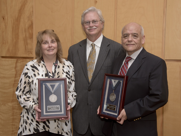 Standing with Summers, center, are 2015 Platinum Award recipients Alexander and Correa.