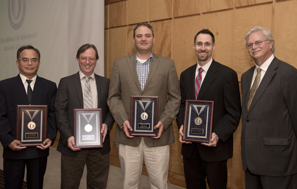 Standing with Summers, right, are 2015 Silver Award recipients, from left, Liu, Akerley, George and,Smith.