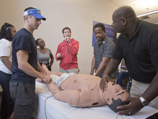 l-r Jason Wheat, (M3) Bertiel Harris, Yolanda Griffin, Nick Hoda (UMMC ER) Lindsey Horton and Elvis McGee during CPR training.