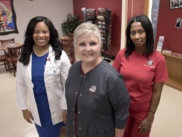 Staffing the new Lanier High School Teen Wellness Clinic are (from left) University of Mississippi Medical Center nurse practitioner CeNedra Lee; Dr. Kate Fouquier, assistant professor in the School of Nursing and the clinic's director; and Priscilla Sterling, an AmeriCorps community health worker.