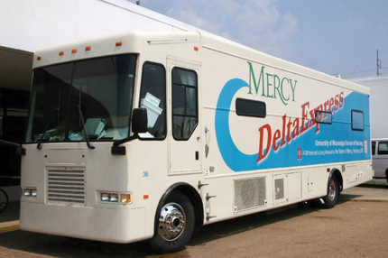 The School of Nursing’s Mercy Delta Express delivers medical and dental care to hurricane evacuees at the Mississippi Trademart