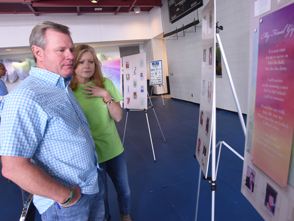 Jackson couple David and Sheila Wilbanks look at posters bearing the photos of organ donors, including their son Walker Wilbanks.