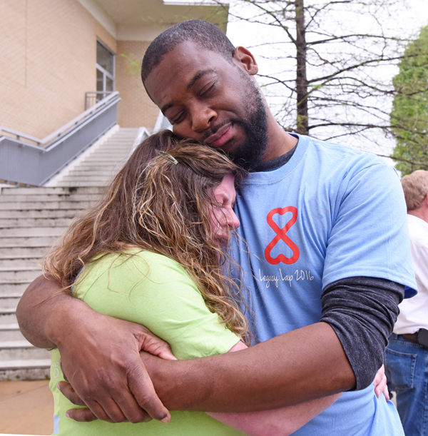 Christine Jordan of Tupelo hugs Sam Walker of Pearl moments after they met for the first time at the Legacy Lap. Walker received the pancreas and kidney of Jordan's son Gabriel.